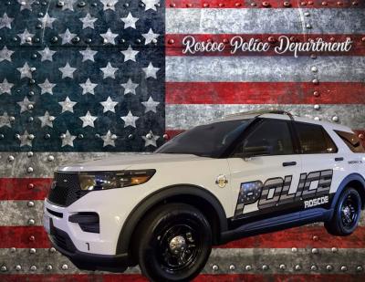 Roscoe Squad car in front of American flag.